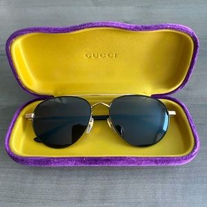 Gucci sunglasses. Black and gold. Unisex